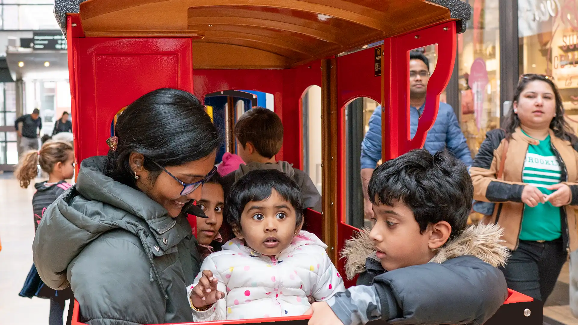 Wattman Mini Express electric trackless train in outdoor operation at a U.S. park or attraction