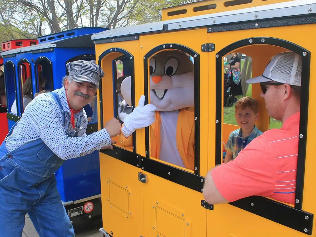 Wattman Maxi Express trackless train in outdoor park operation, upgrade path supported by the Assured Value Program guaranteed trade-in credit